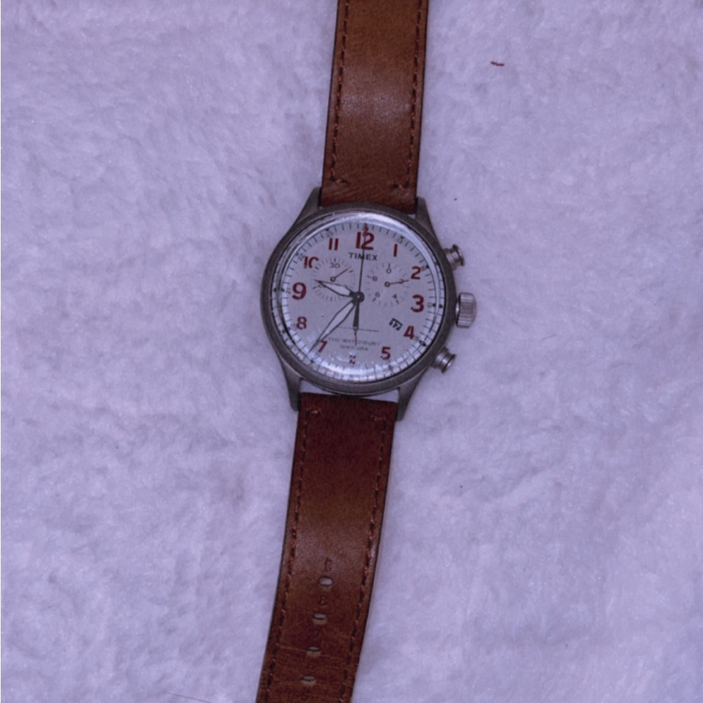 Timex men’s watch. Has plastic film on the glass portion of the watch.